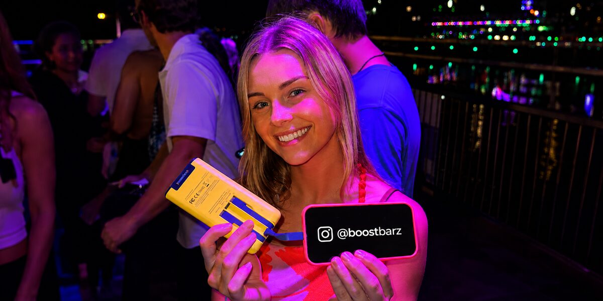 Guests at a nighttime BoostBarz event